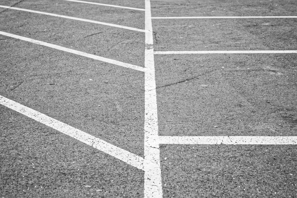 Commercial asphalt parking lot with fresh yellow stall lines